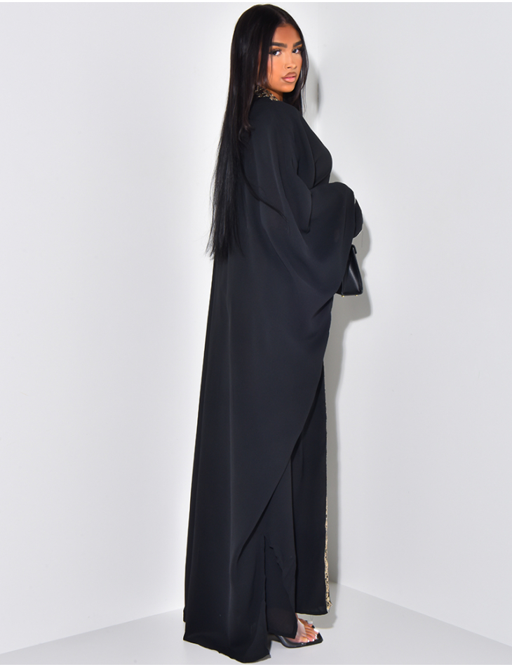 Loose-fitting abaya with embroidered gold ties